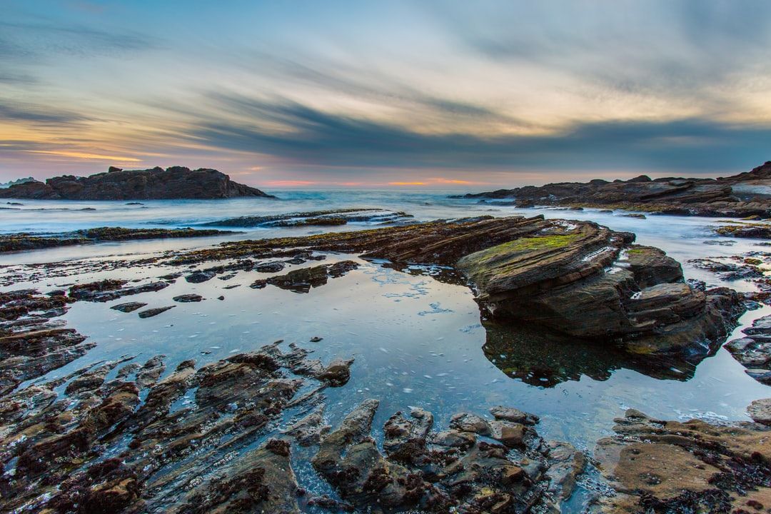 Don’t let the brightness in the image fool you.  By the time  this photo was taken, it was near pitch dark on the rocky shore at Weston Beach in Point Lobos Natural Reserve.  After the shoot, it was a challenge to get back on the trail that took me back to the parking lot, and it turned out the Park Ranger was already out searching for me because I overstayed way passed the closing time.  Although annoyed at my lack of attention to the park schedule, he was also visibly pleased that he didn’t need to file a casualty report.  The photo was taken on a tripod, low to the ground and level.